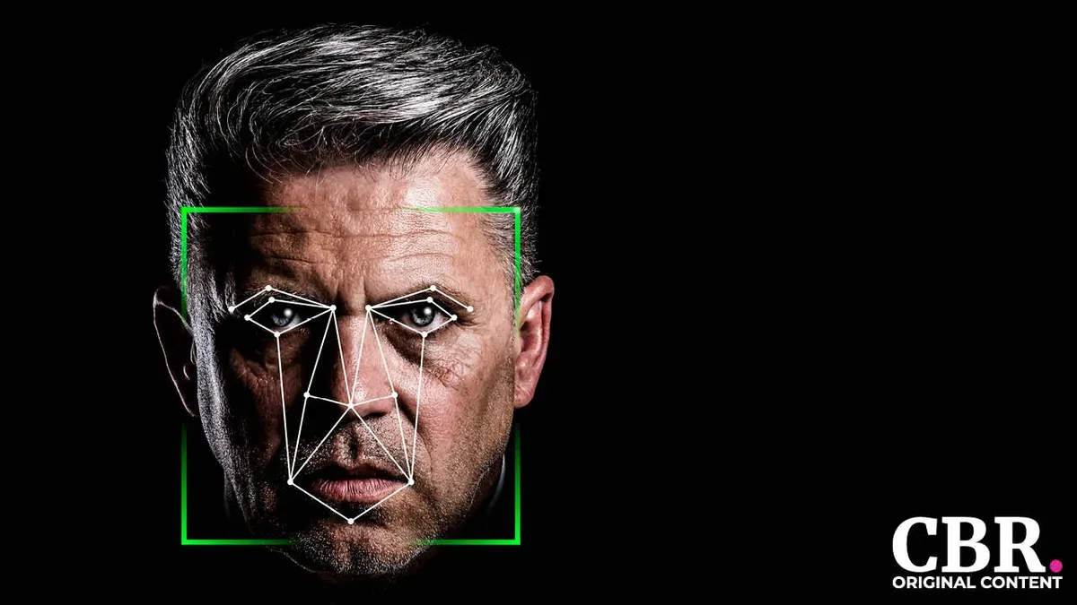 A man's face overlaid with facial-recognition tracking points inside a green scan frame